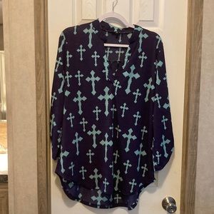 Turquoise cross shirt.